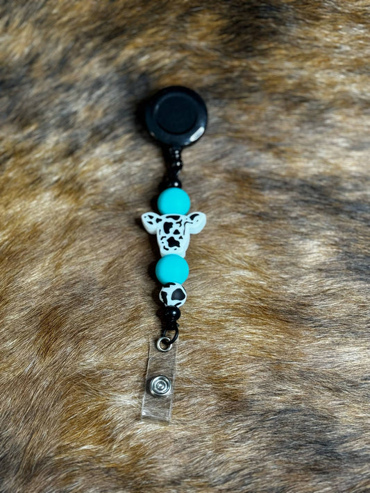 Moo Bright Turq. Badge Reel